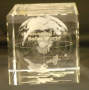 Glass cube, globe world etched inside,