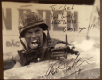 Photo of soldier firing machine gun, signed, 