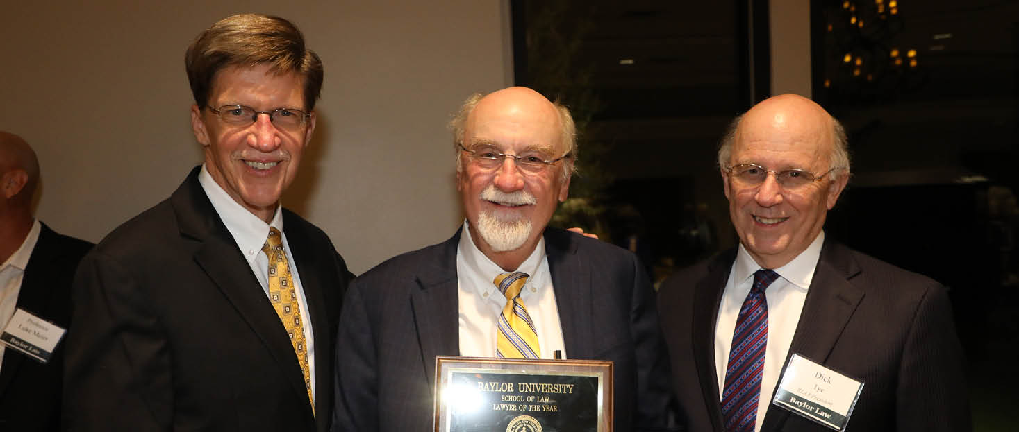Photo of Professor Powell, alongside the Dean and the Law Alumni Association President