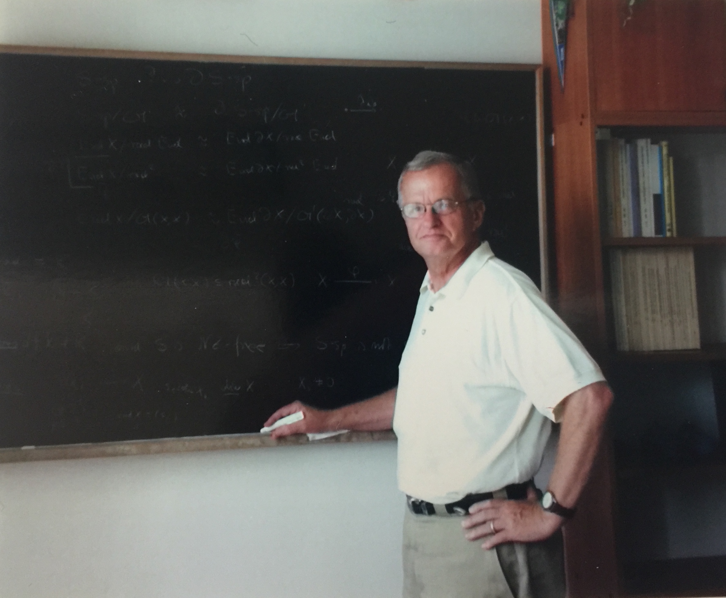 David Arnold standing at chalkboard