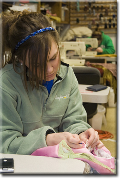 Jean sewing in the costume shop.