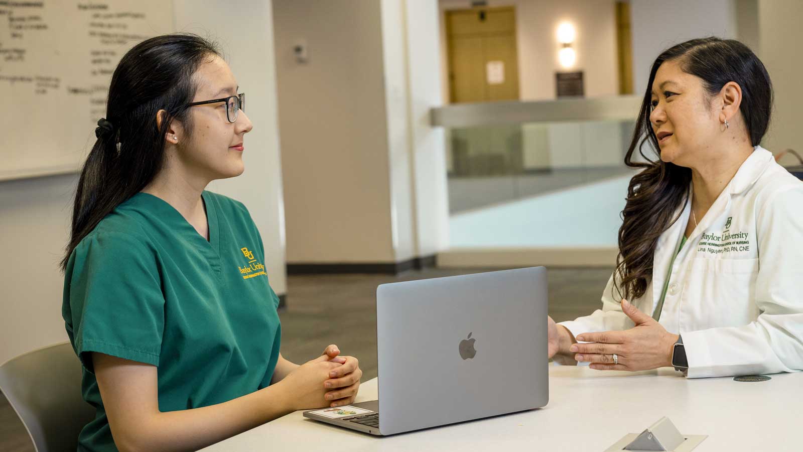 Connie Tran (left), level four nursing student from Cypress, Texas, and mentor and faculty advisor, Lina Nguyen, Ph.D.