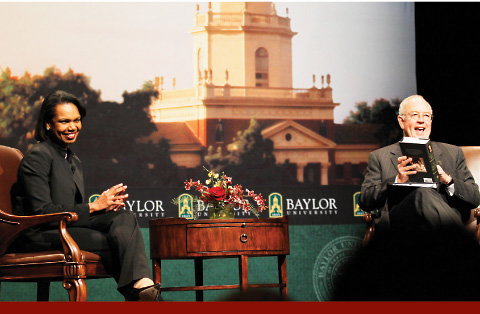 Photo of Condoleezza Rice talking with Ken Starr on stage