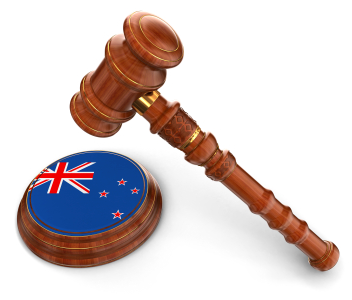 Stock photo of a gavel and a New Zealand flag