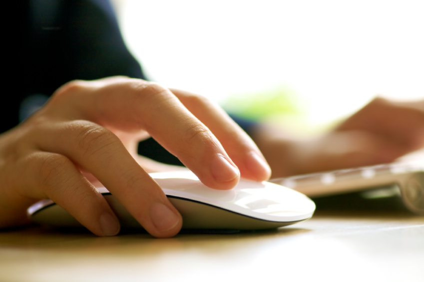 Hand grasping a computer mouse