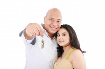 Stock photo of a couple with new house keys