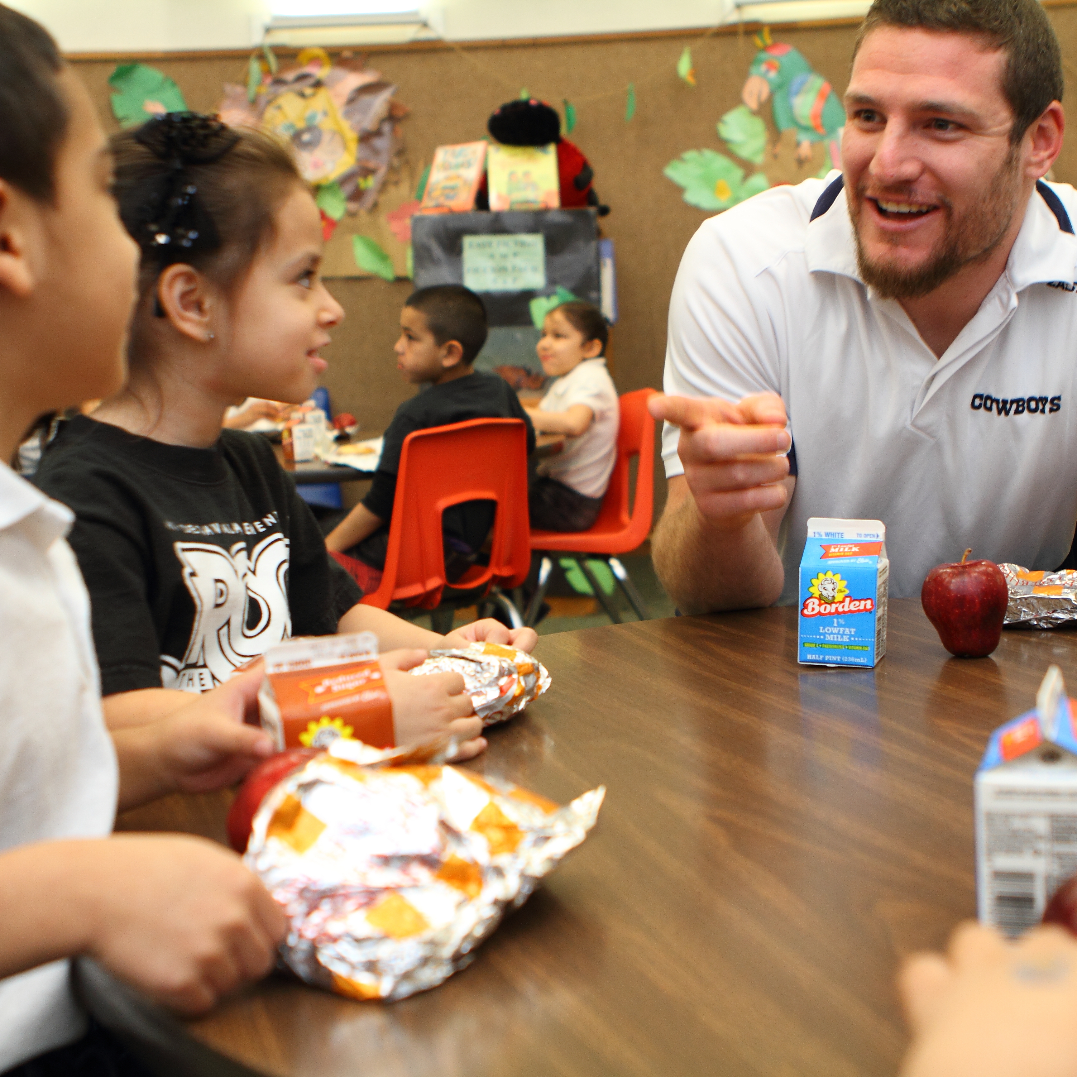 students interacted with teacher at breakfast