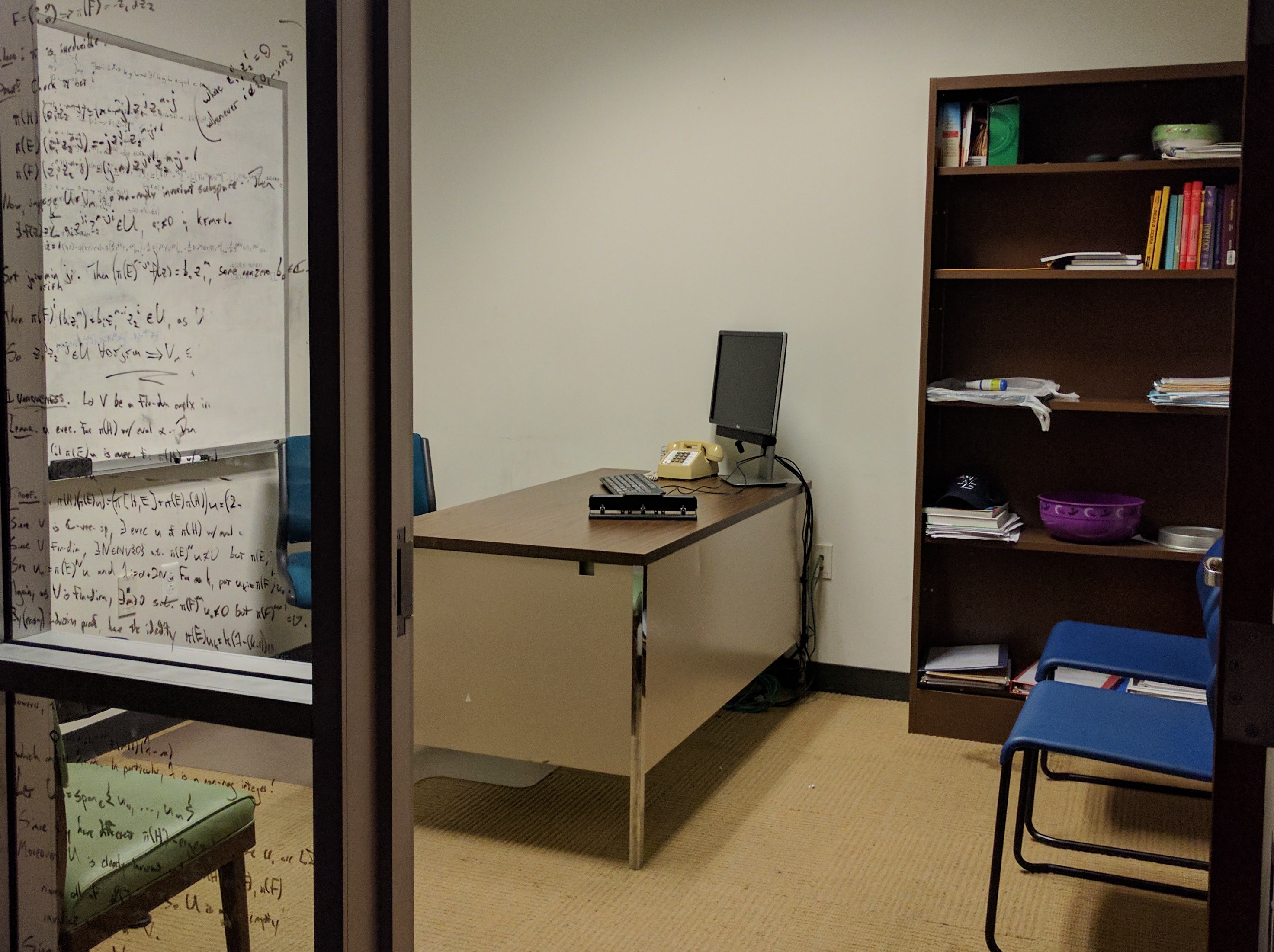 Baylor Mathematics Office with glass walls, upon which equations are written