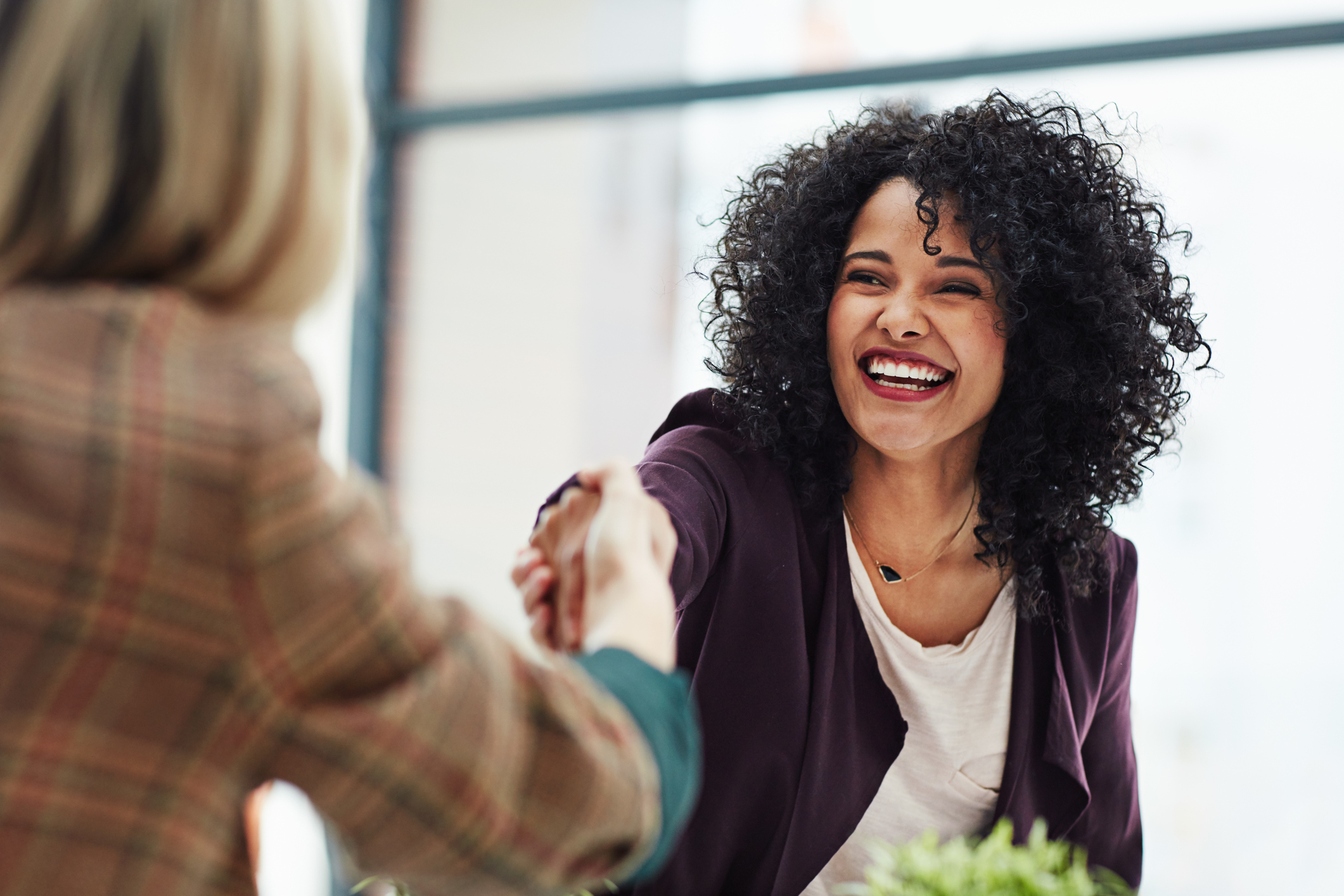 Stock photo of a woman shaking hands