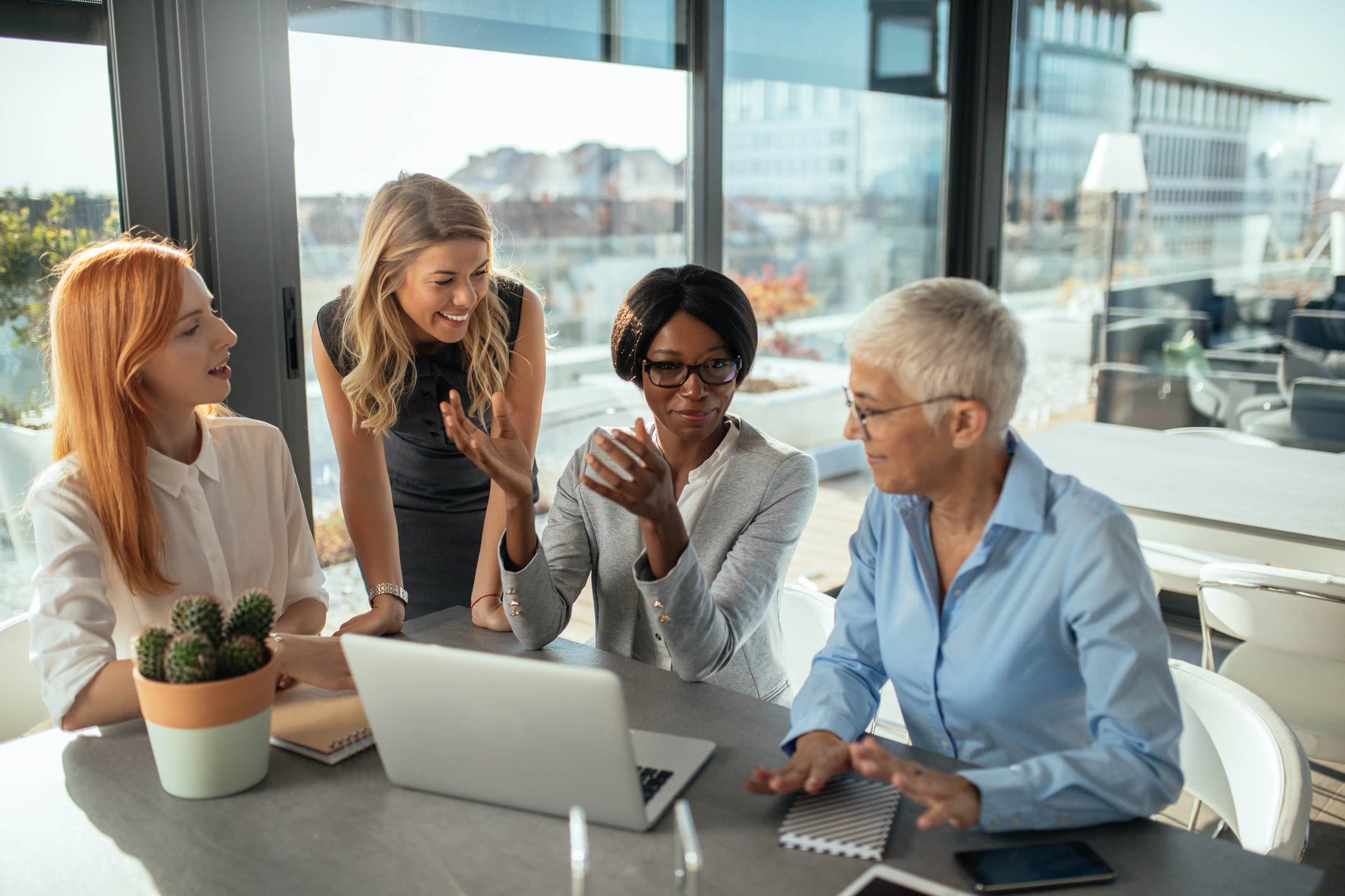 Stock photo of four businesswomen meeting