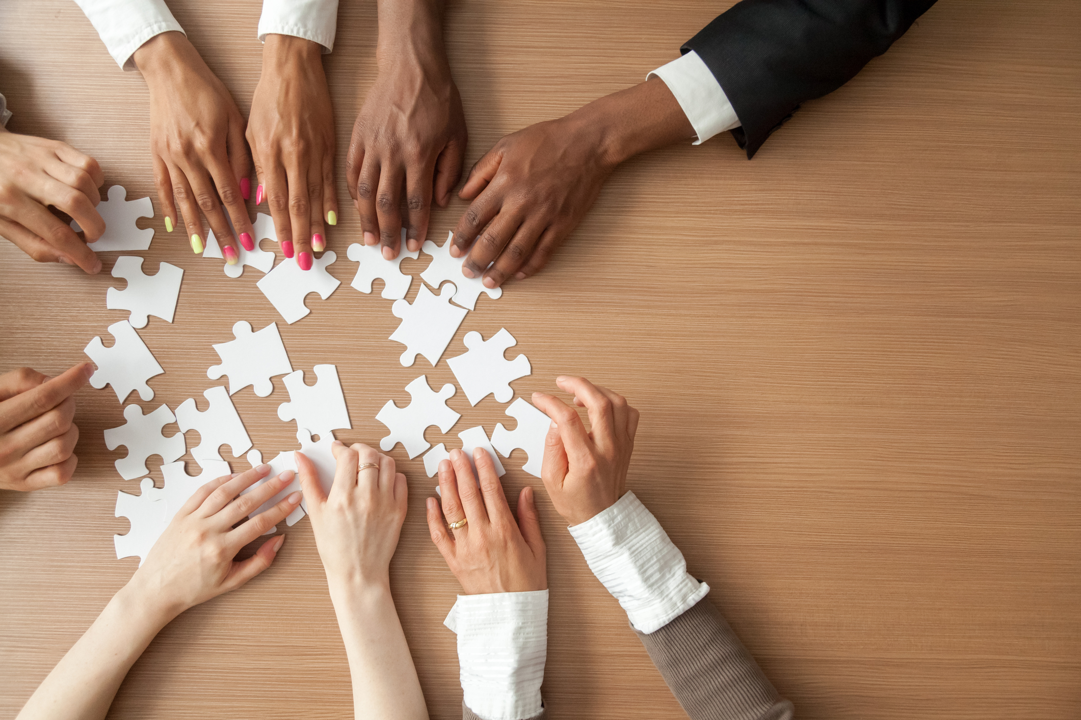 Stock photo of a business team putting a puzzle together