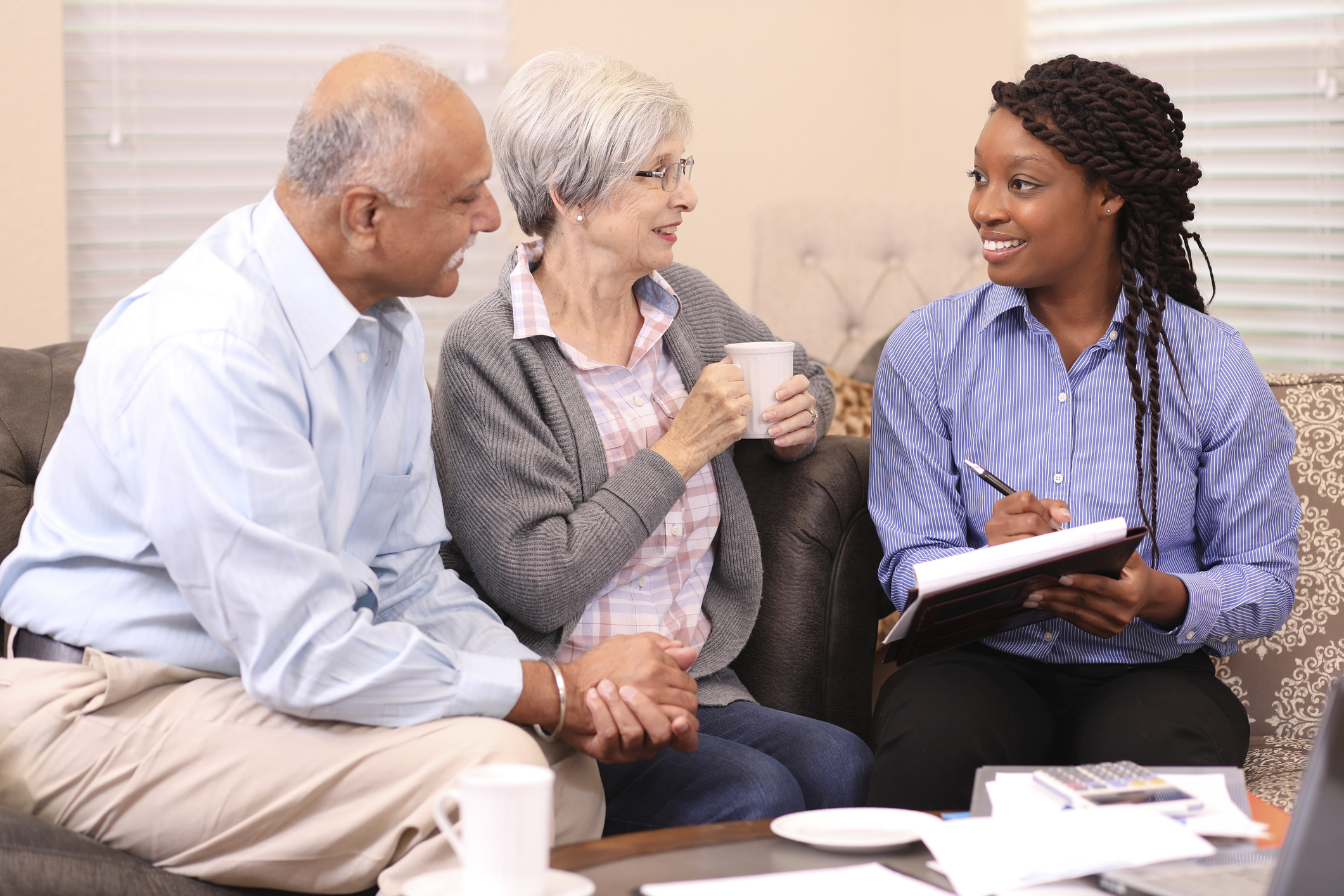 stock photo of elderly couple meeting with a professional