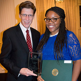 Dean Toben presents Tycha Kimbrough with her award