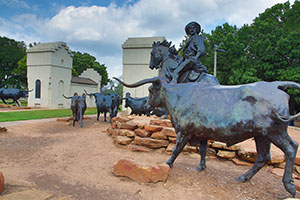 Waco Suspension Bridge and cattle drive statues