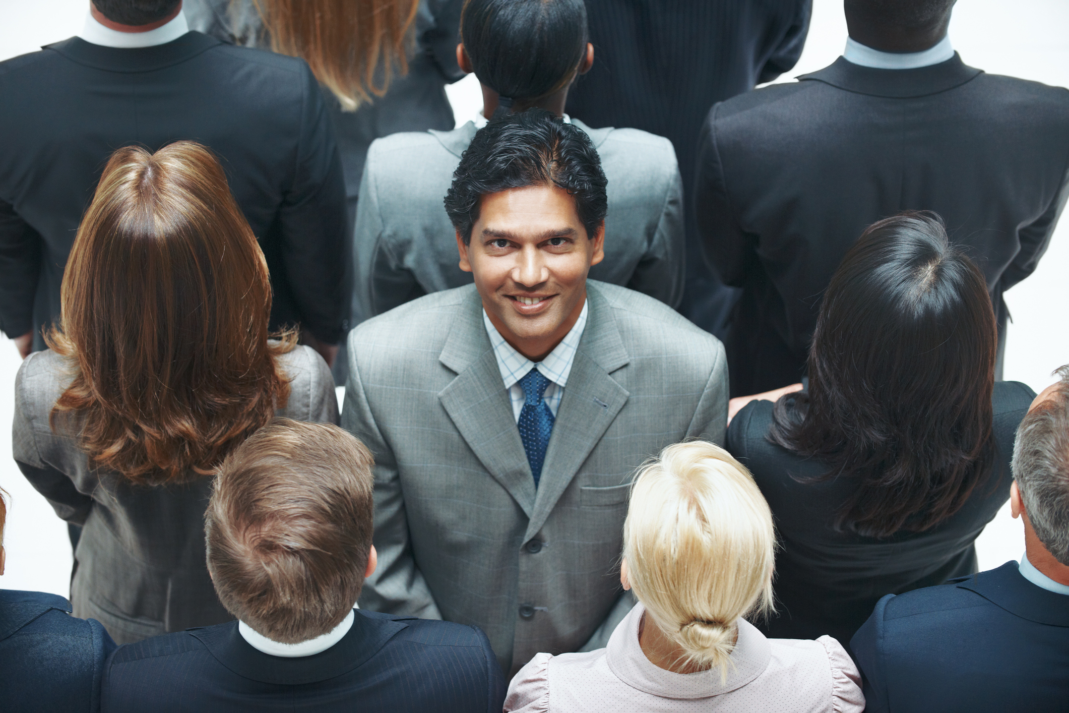 Stock Photo of a businessman against the stream of other businesspeople