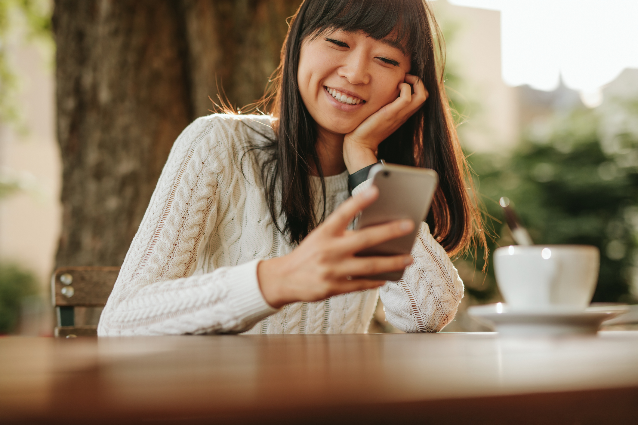 Stock photo of a woman with a smart phone in her hand