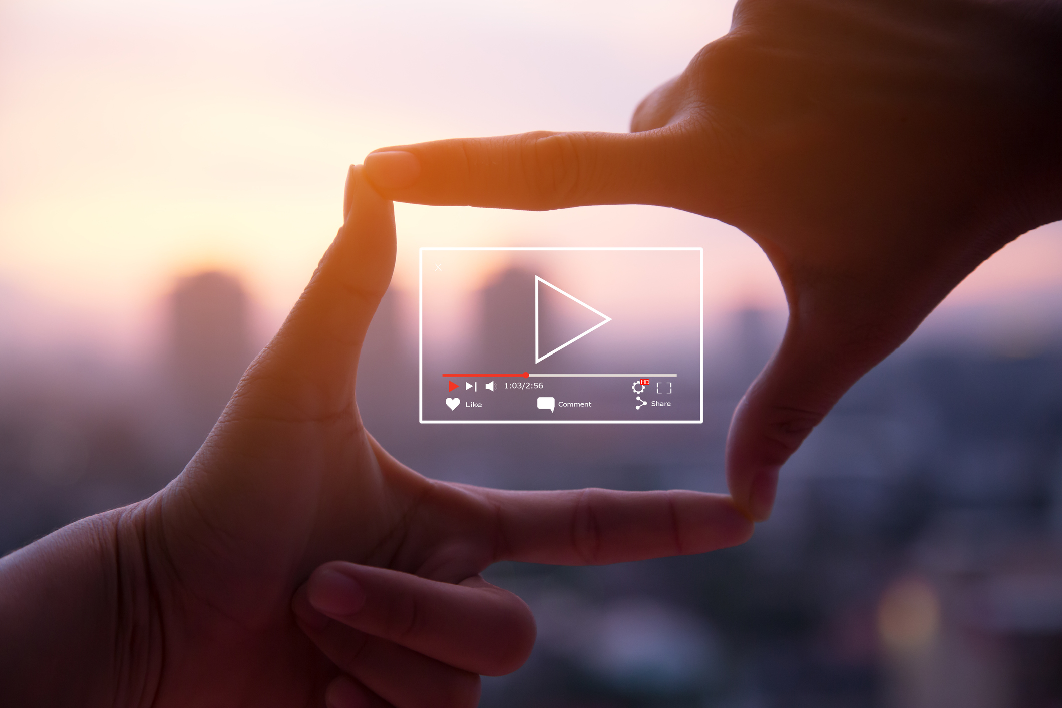 stylized photo of hands framing a youtube frame