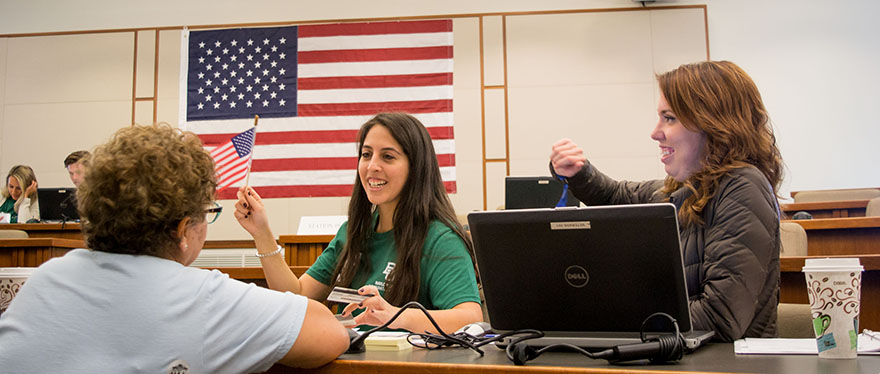Banner image of naturalization office with applicants and Baylor Law student help