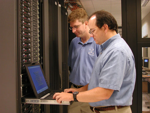 Carl Bell and Michael Hutchinson fixing a server
