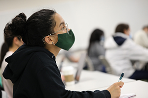Image of student in class in a protective cloth mask