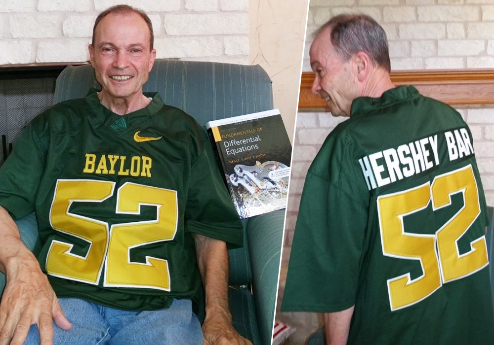 Johnny Henderson wearing a Baylor Bears jersey gifted to him by his differential equation students.