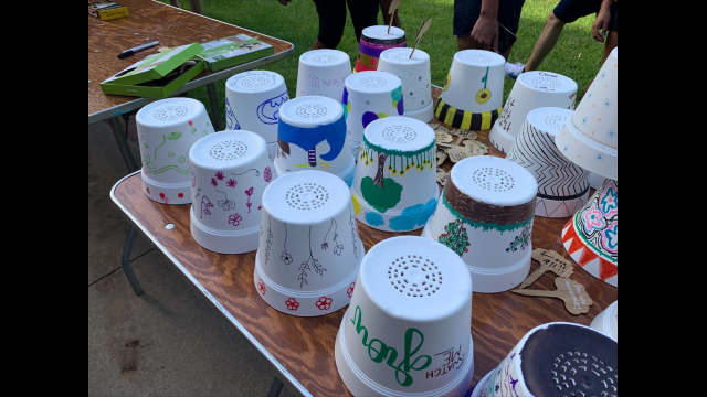 Flower pots decorated for local elementary and middle school students.