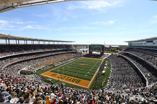 Photo of McLane Stadium, filled with football fans clad in green and gold