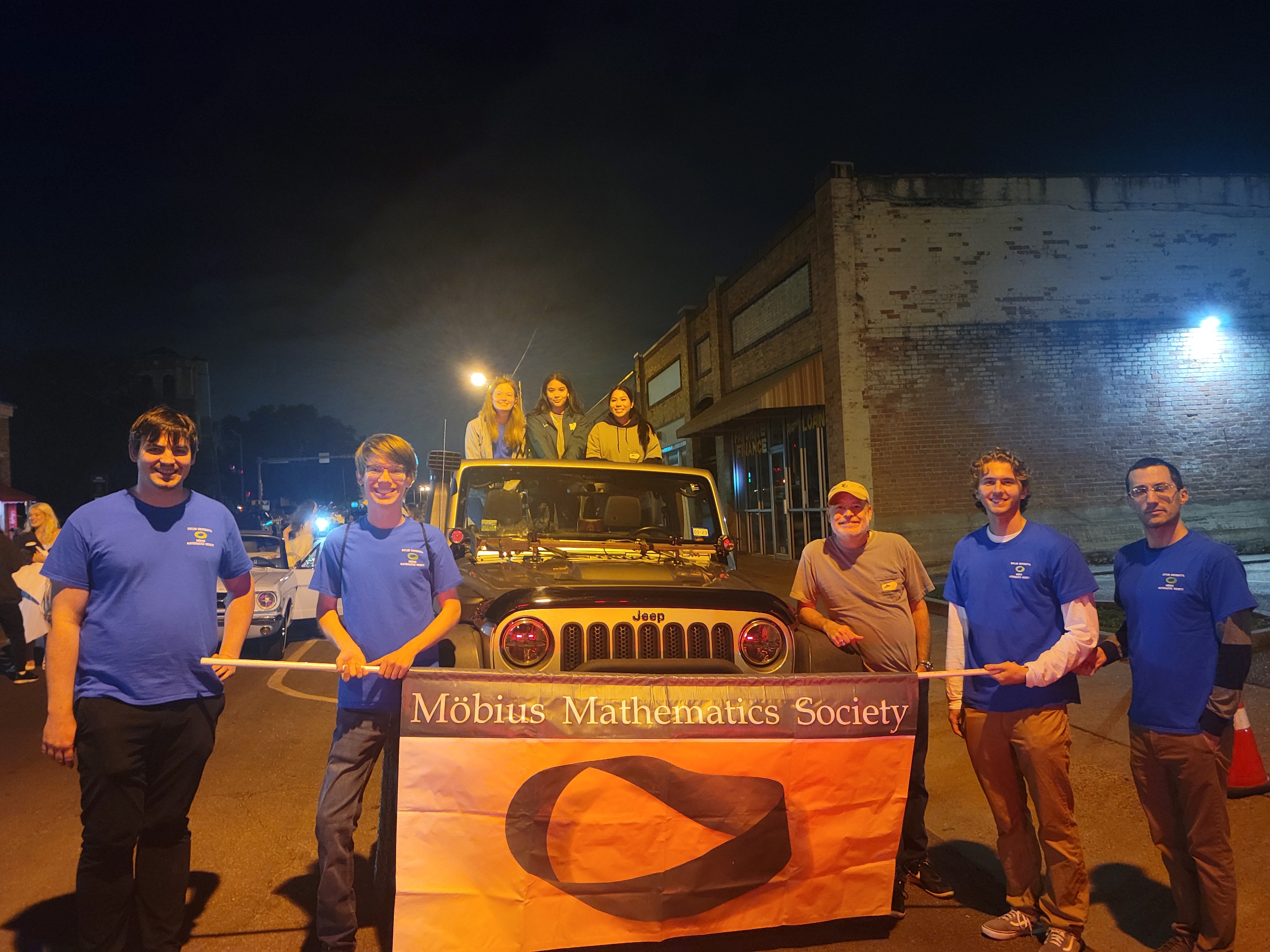 Members and organizers of the Mobius Math Society pose for a photograph on the day of the 2022 Baylor Homecoming Parade.