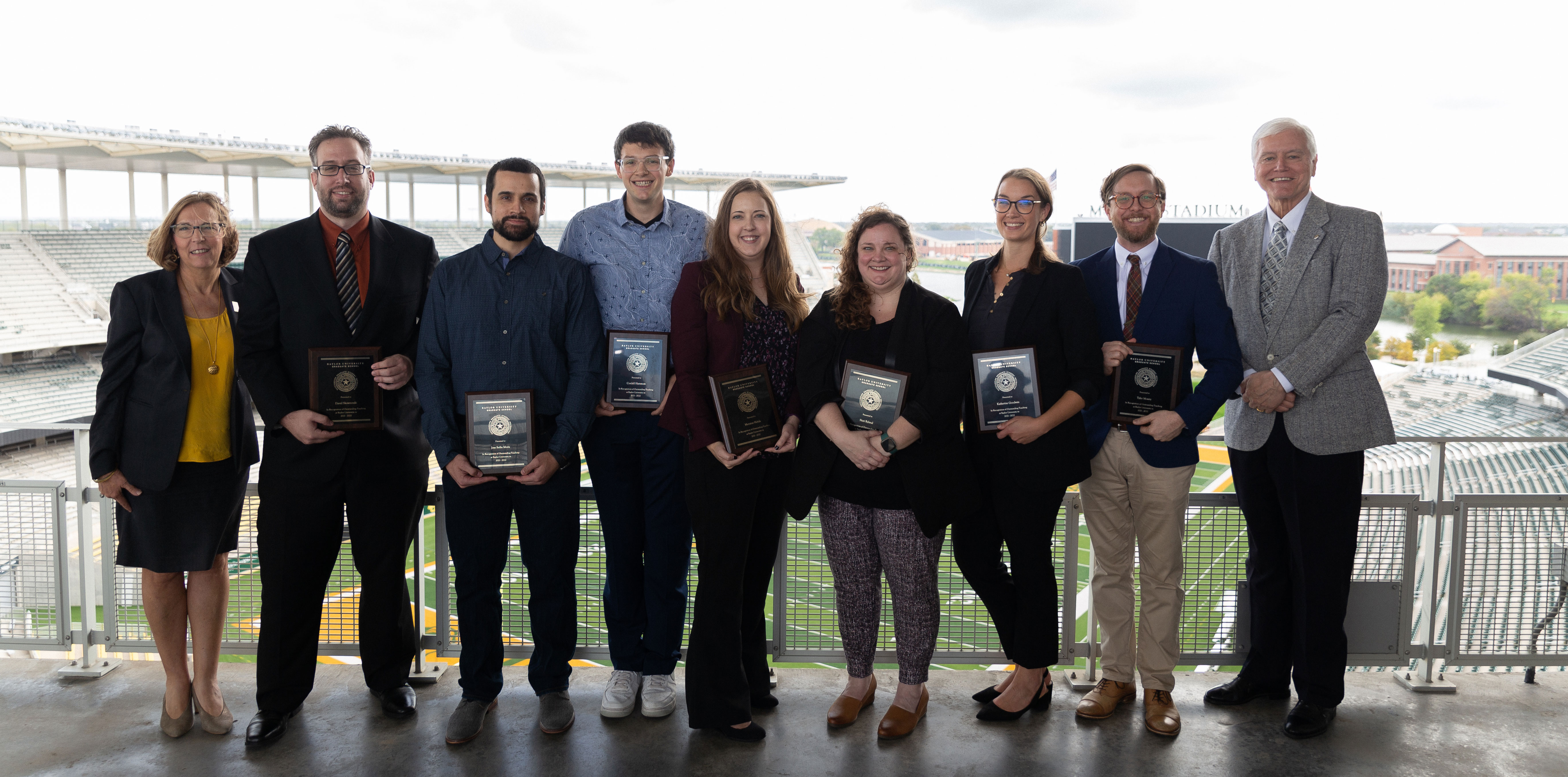 The 2021-22 Outstanding Graduate Student Award recipients with Provost Nancy Brickhouse and Graduate School Dean Larry Lyon